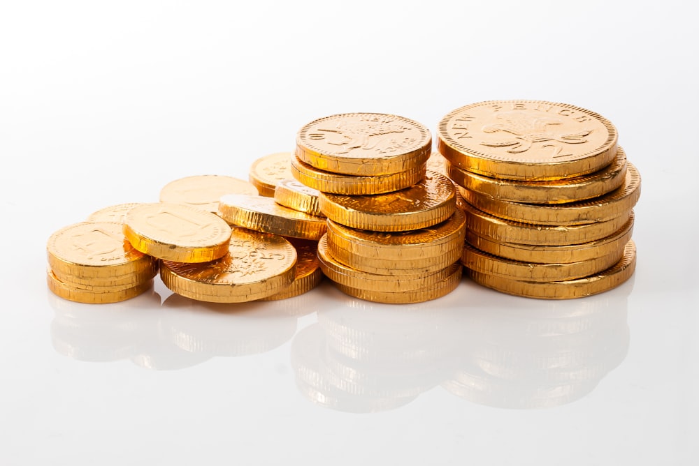 Tumpukan koin emas untuk promo cashback slot